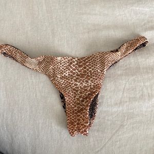 Acacia Swim cheeky bikini bottoms in reversible snake print. Size L